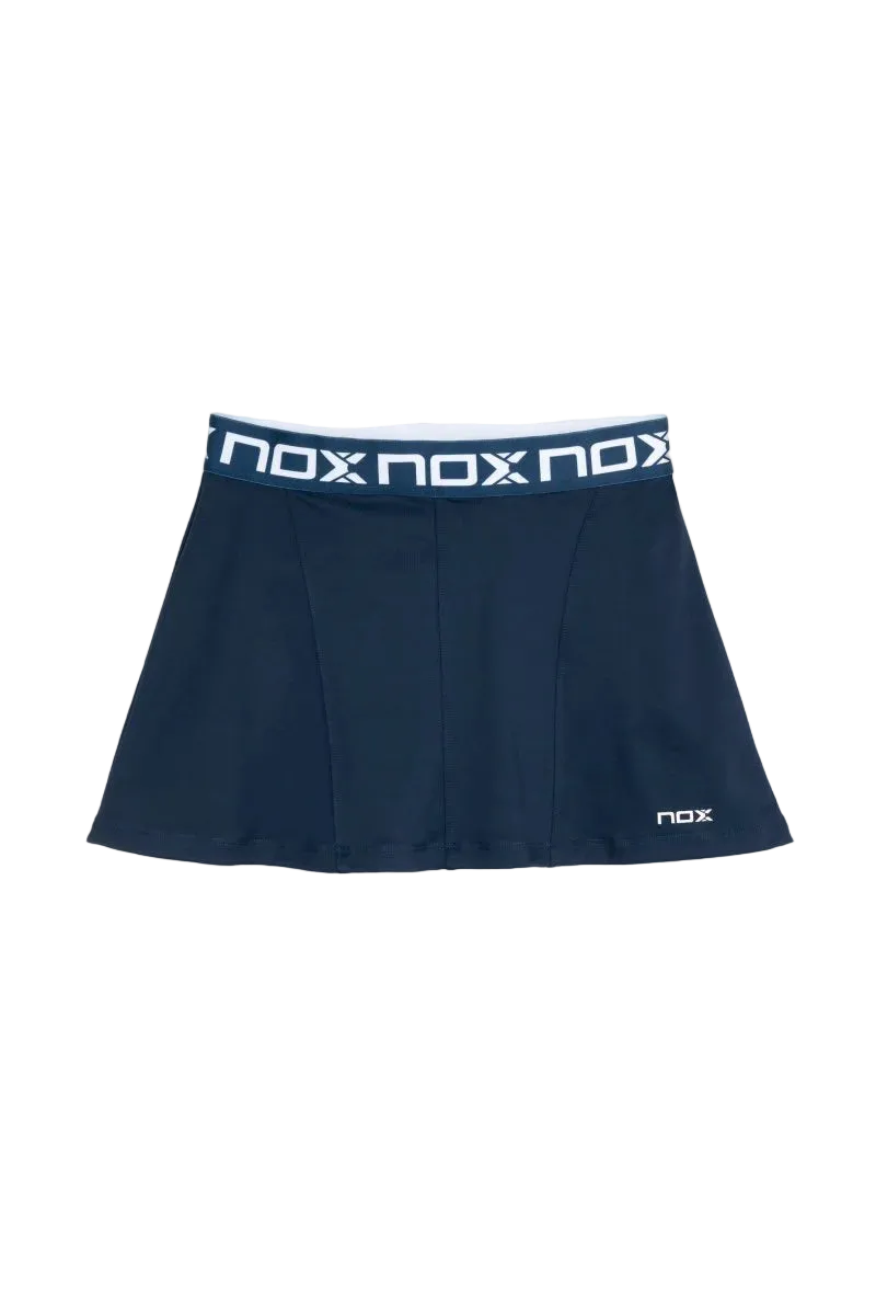 Falda de pádel Nox Sport Team Azul 2026 con tablas laterales y cintura elástica. Diseño deportivo en azul marino que incluye short interior al tono para máxima cobertura y tejido técnico de alta transpirabilidad 